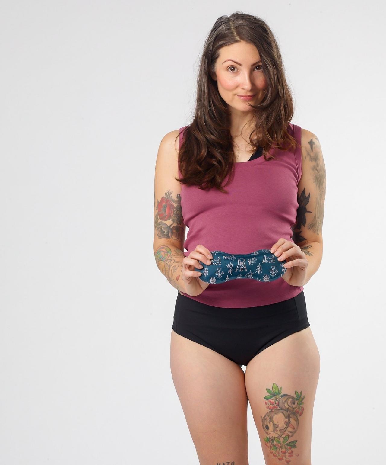 Woman holding a Nyssa Uterine Reusable Ice/Heat Pack