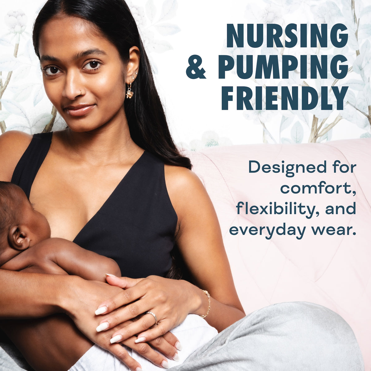 A woman in a black nursing-friendly tank top holds a baby while sitting on a light pink couch. Text on the right reads 'NURSING & PUMPING FRIENDLY' and 'Designed for comfort, flexibility, and everyday wear.