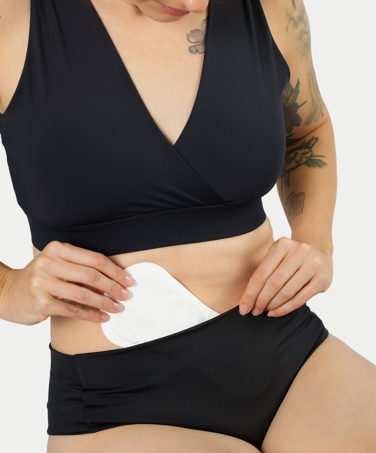 Woman inserting Nyssa On-The-Go Heat Press into VieWear Underwear